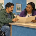 Conceptual painting of a wheelchair user reviewing a benefits folder with a counselor.