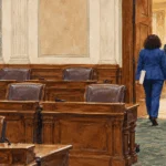 Conceptual watercolor of lawmakers leaving a state legislative chamber.